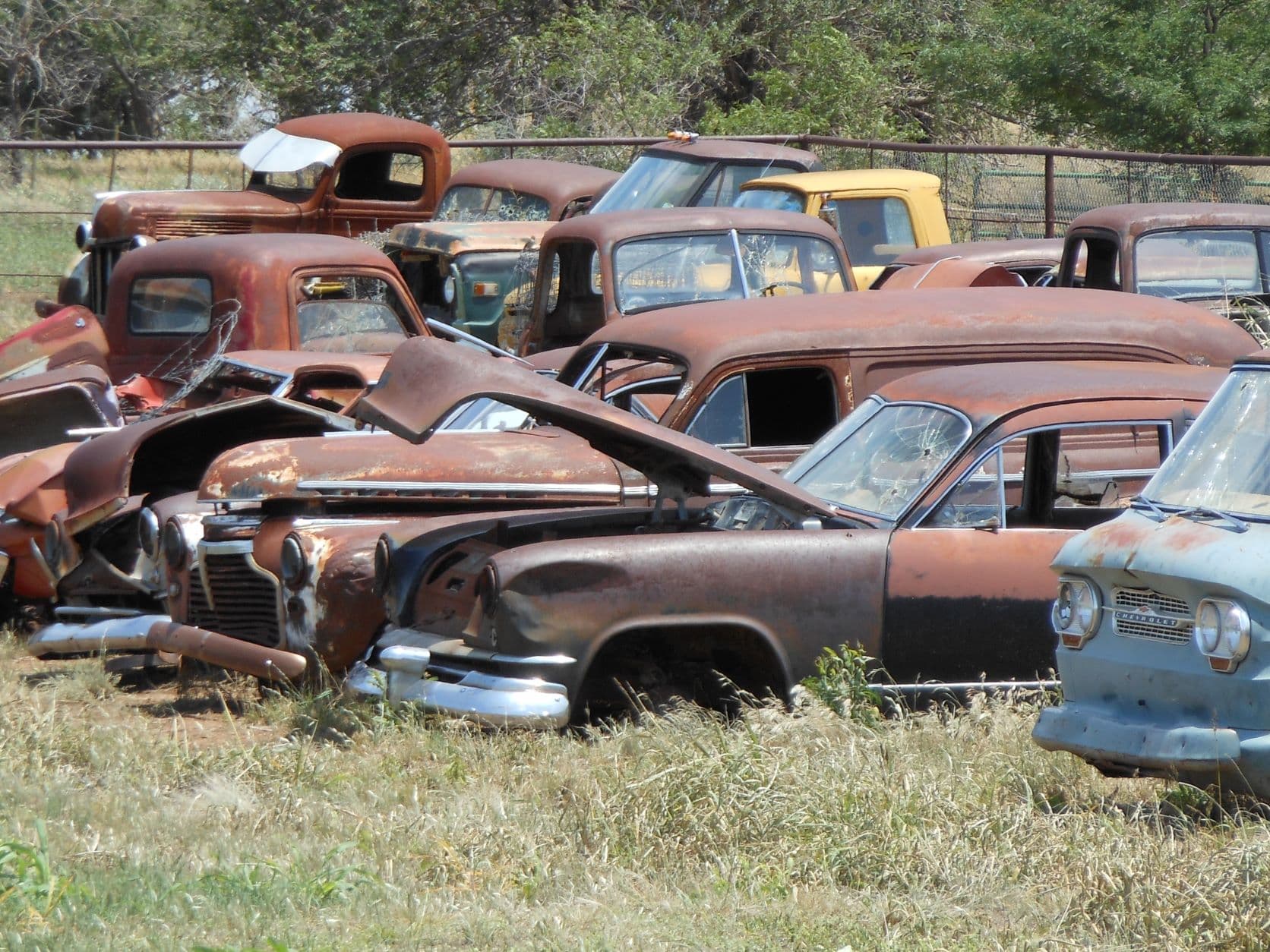 Front of 1960s Corvair pickup or van on the right - with some friends