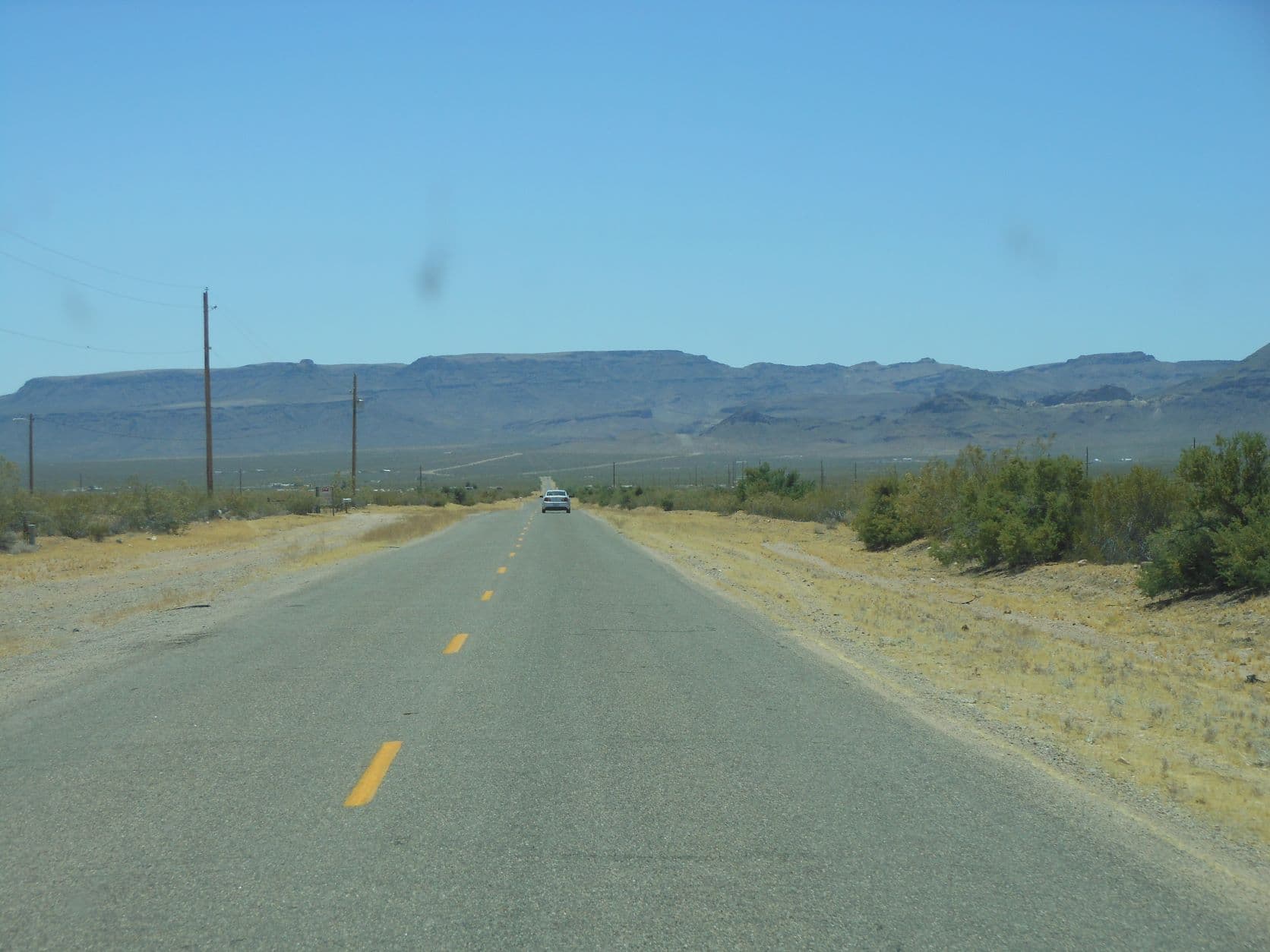 Desert highway to the desert mountains - Road to Oatman, AZ